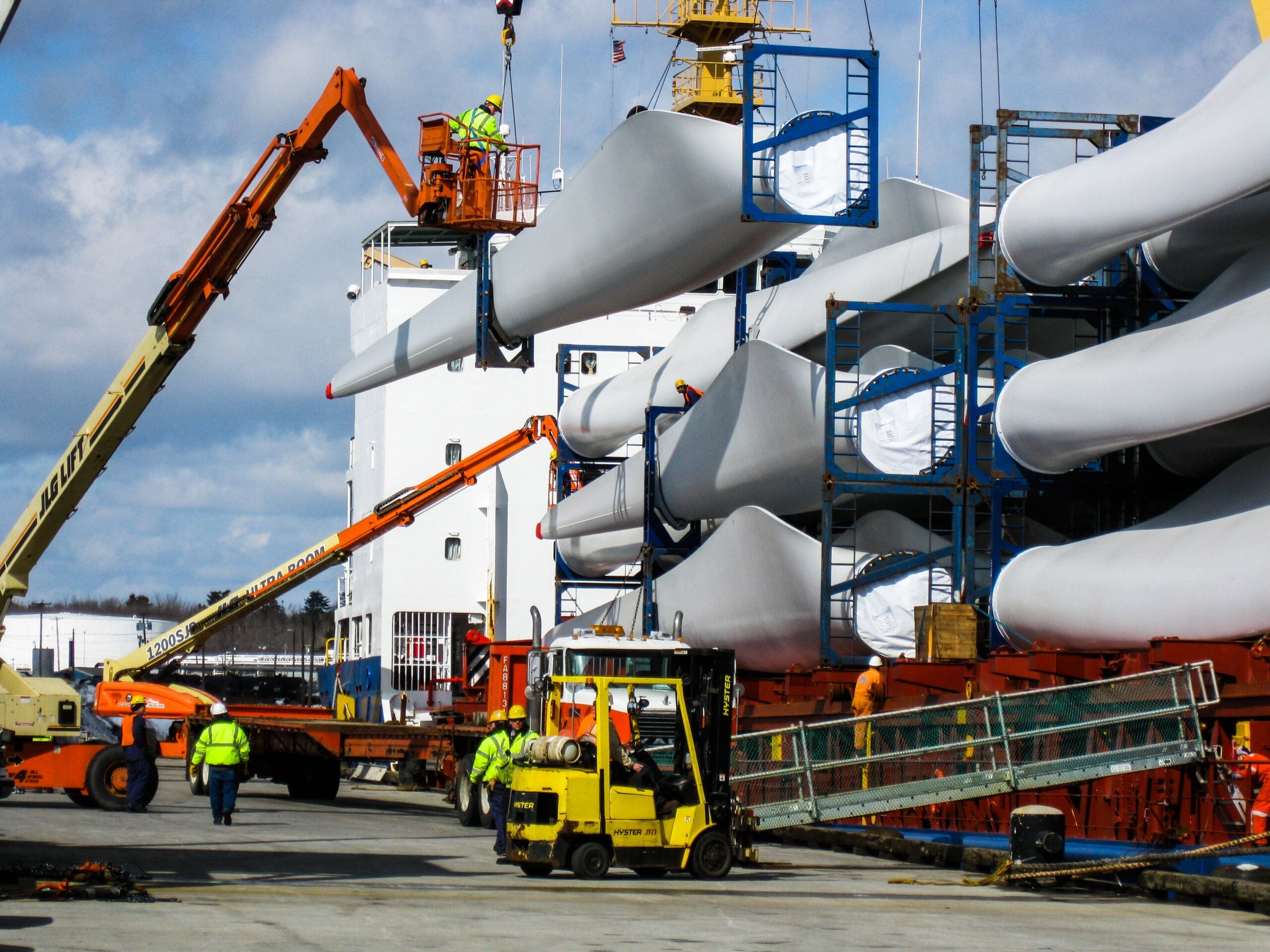 Wind turbine blades being offloaded at Sprague’s port, supporting renewable energy logistics.